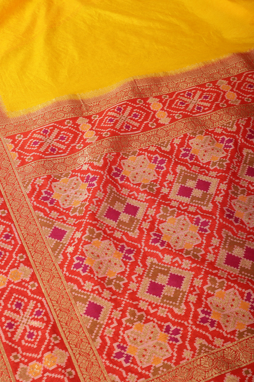 Yellow & Red Dual Toned Tussar Silk Patola Woven Saree