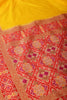 Yellow & Red Dual Toned Tussar Silk Patola Woven Saree