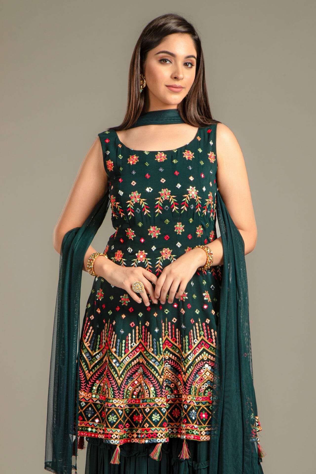 Bottle Green Georgette Peplum Gharara Suit.