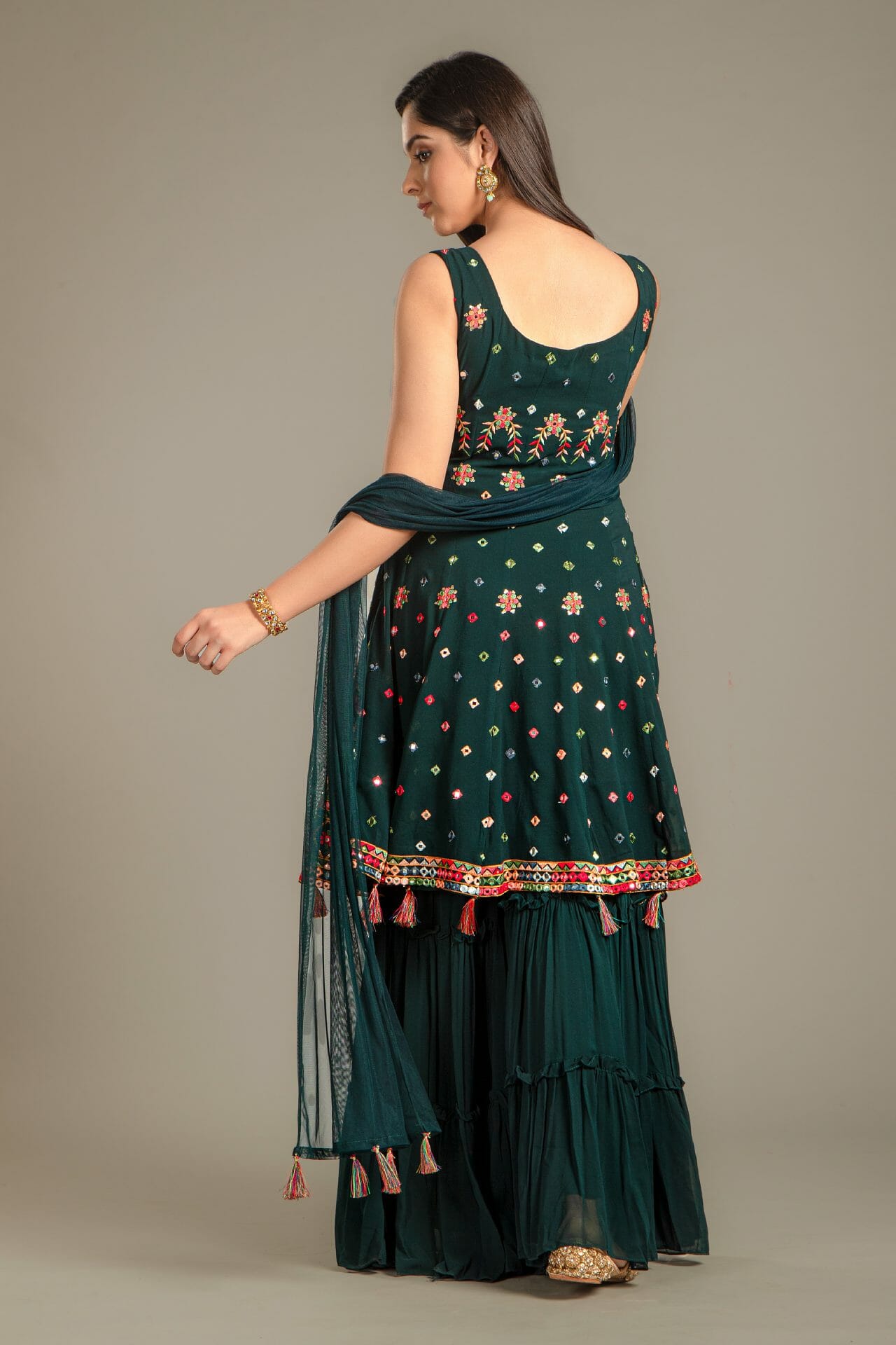 Bottle Green Georgette Peplum Gharara Suit.