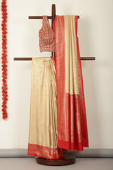 Beige & Red Dual Toned Soft Silk Zari Woven Saree