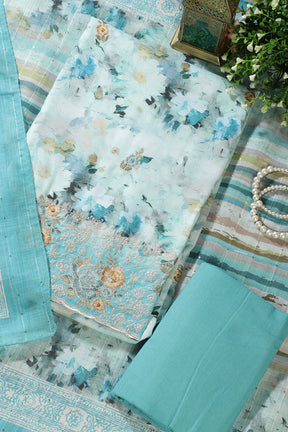 Turquoise Cotton Floral Printed And Hemline Embroidered Unstitched Suit