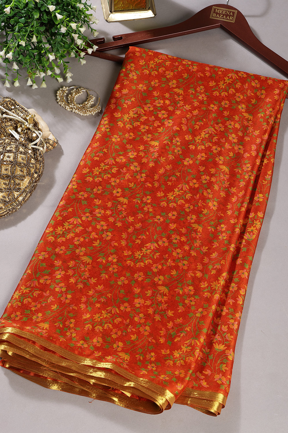 Orange Floral Printed And Zari Border Chiffon Saree