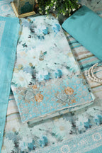 Turquoise Cotton Floral Printed And Hemline Embroidered Unstitched Suit