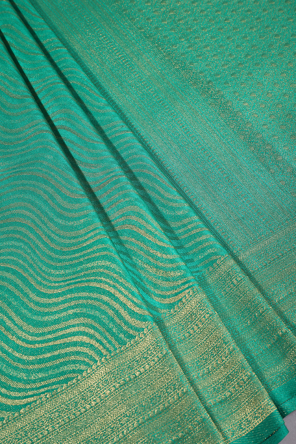 Teal Green Color Soft Silk Leheria Zari Woven Saree
