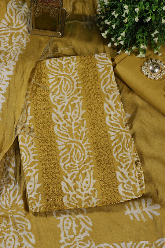 Mustard Cotton Printed And Resham Embroidered Unstitched Suit Material