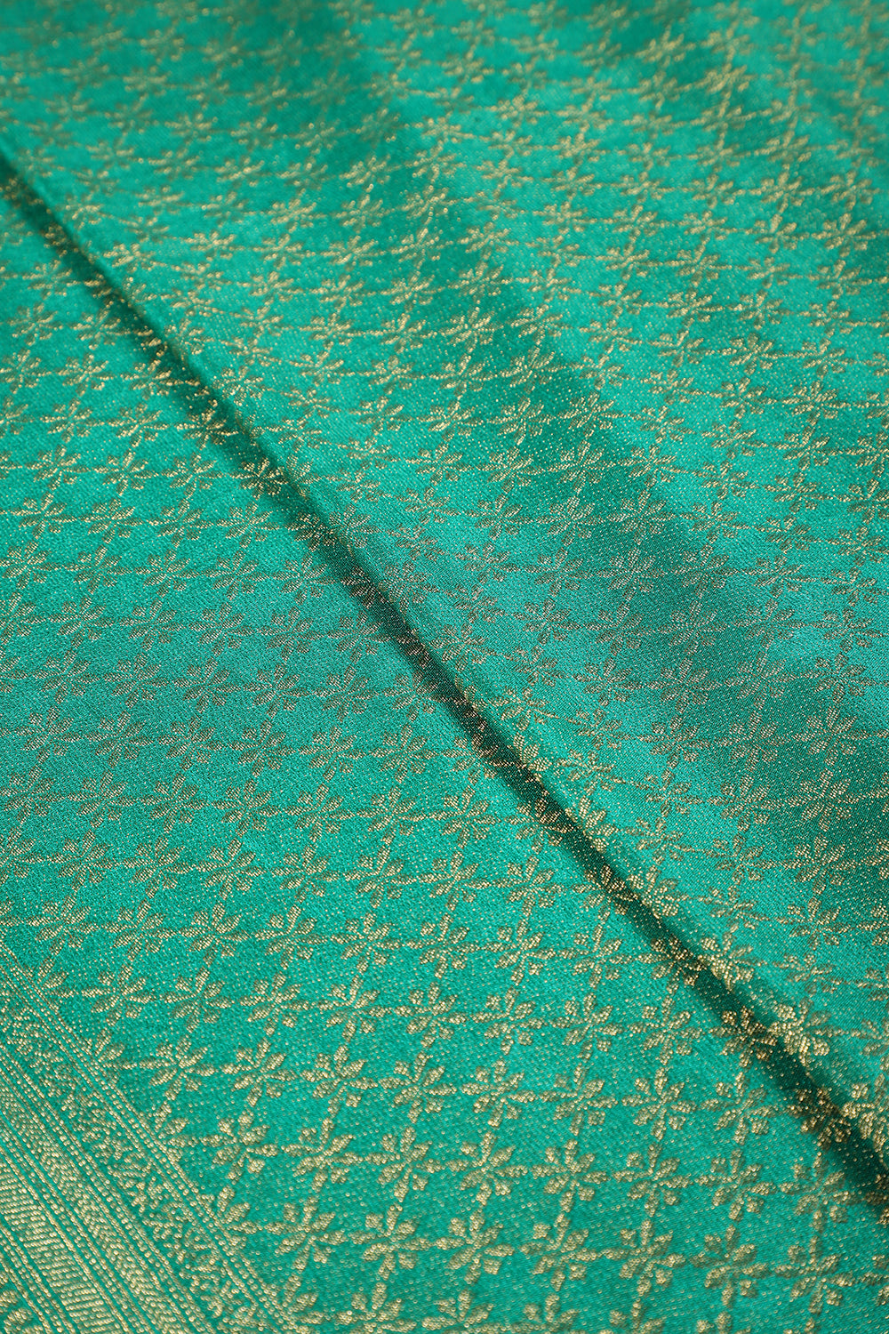 Teal Green Color Soft Silk Leheria Zari Woven Saree