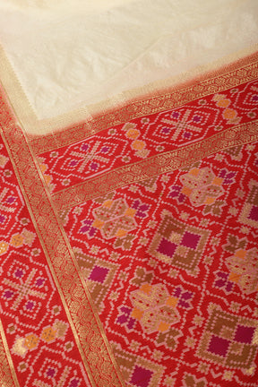 Cream & Red Dual Toned Tussar Silk Patola Woven Saree