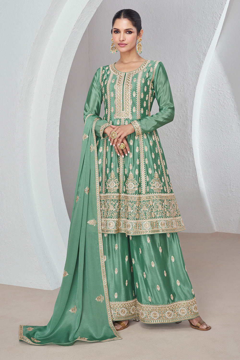 Sea Green Color Embroidered Crepe Silk Peplum Suit