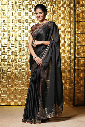 Black Satin crepe saree with swarovski work.