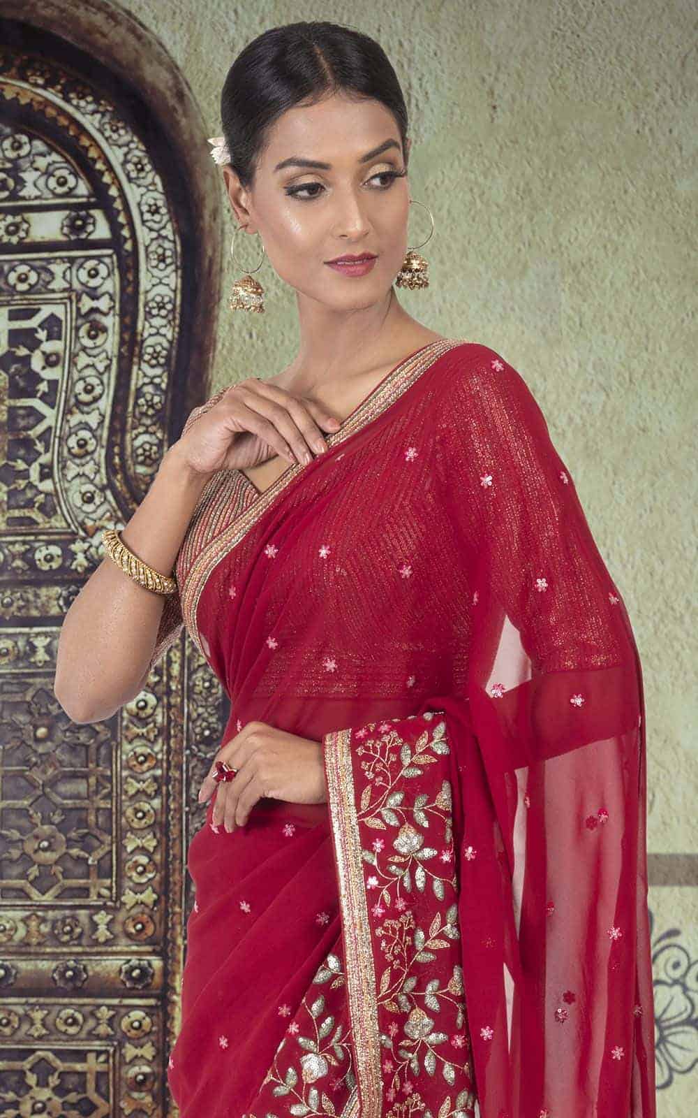 Maroon Georgette Saree with sequins work.