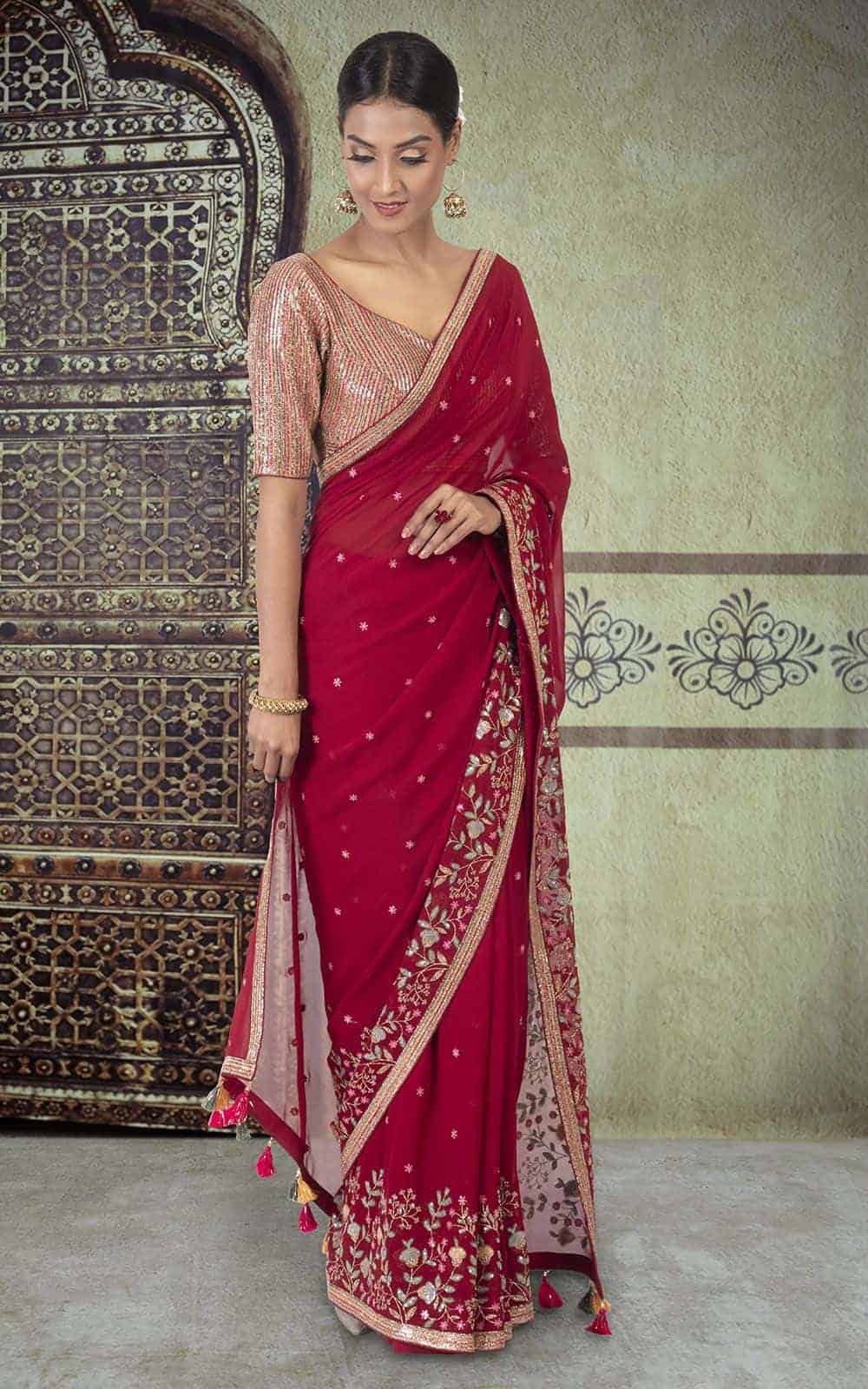 Maroon Georgette Saree with sequins work.