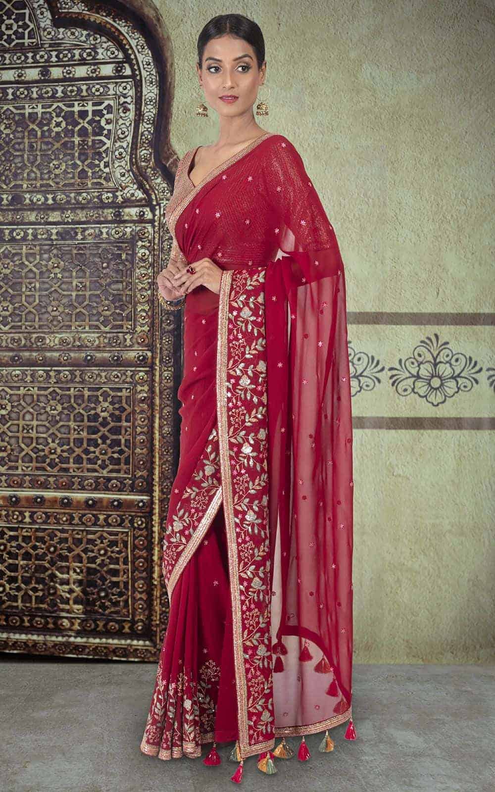Maroon Georgette Saree with sequins work.