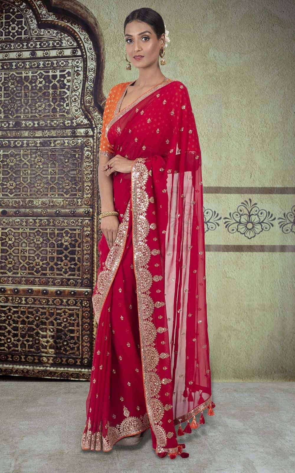 Crimson Red Georgette Saree with sequins and zari work.