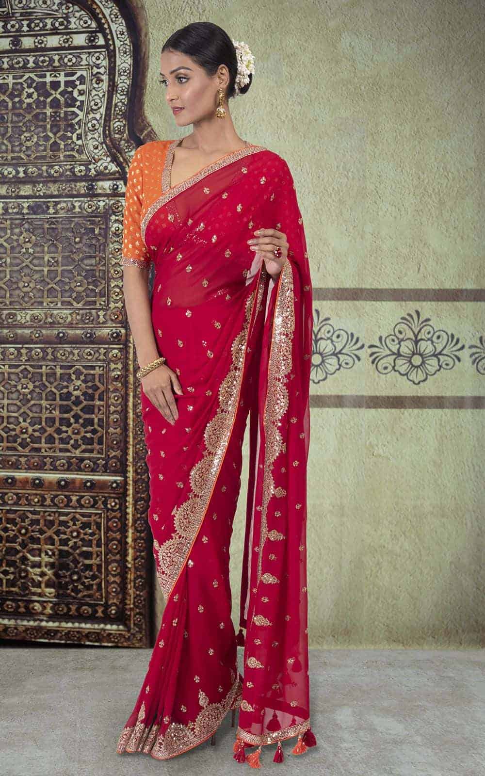 Crimson Red Georgette Saree with sequins and zari work.